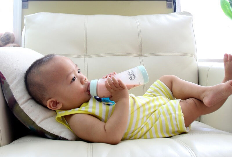 Kid chilling and drinking